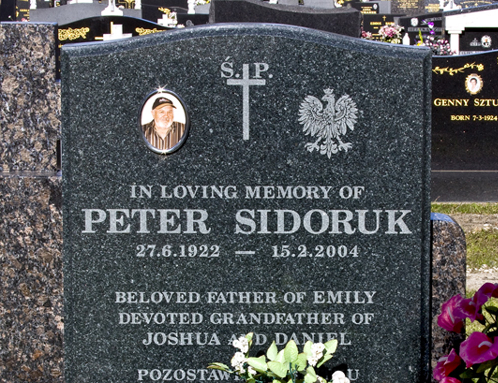 black headstone with gold lettering